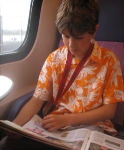 886144_69386077_boy on train reading_Herman Brinkman_stock exchange