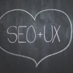 ux and harmonizing seo and web design: a heart drawn on a chalk board with SEO and UX in the middle